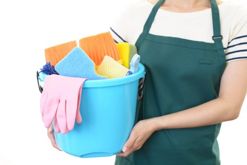 Cleaner maintaining an apartment lobby during communal area cleaning