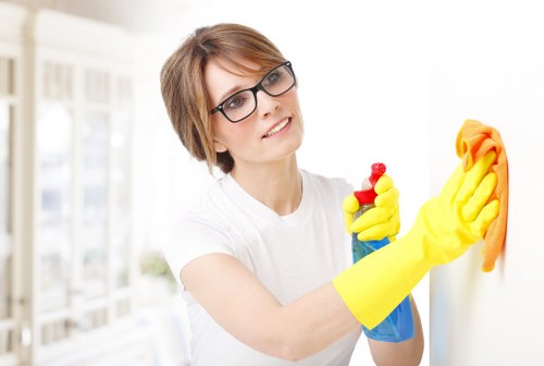 Specialized upholstery cleaning equipment in use on a fabric chair