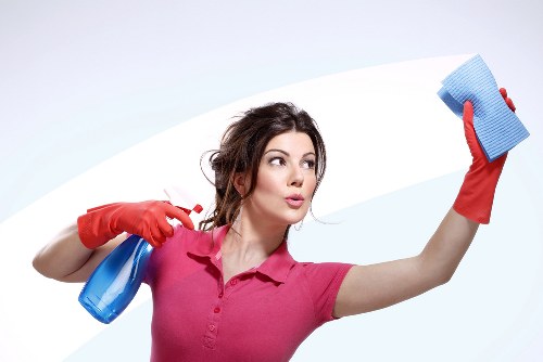 A cleaner in Fulham carrying out detailed room cleaning